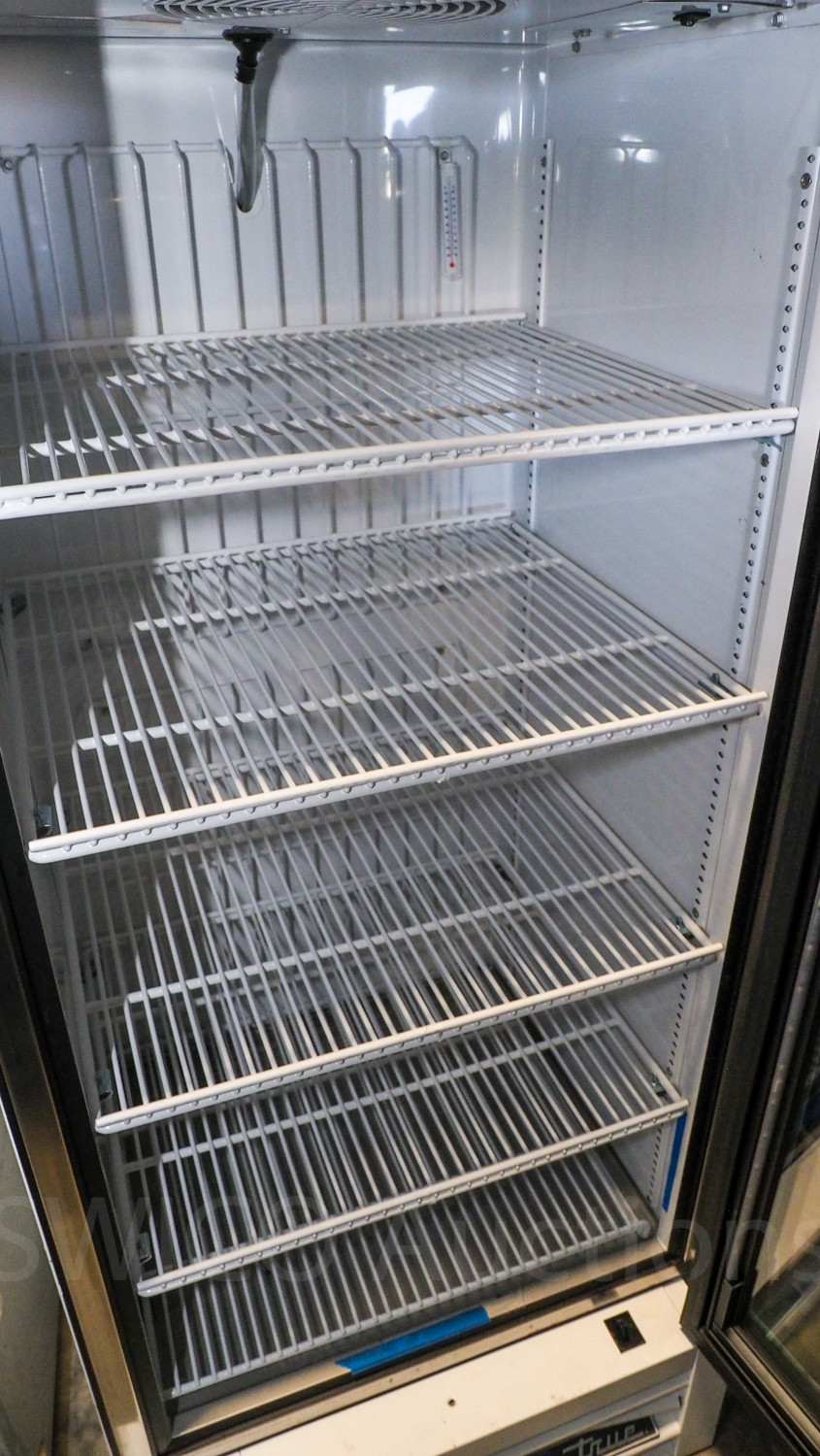 True glass door refrigerator Swico Auctions
