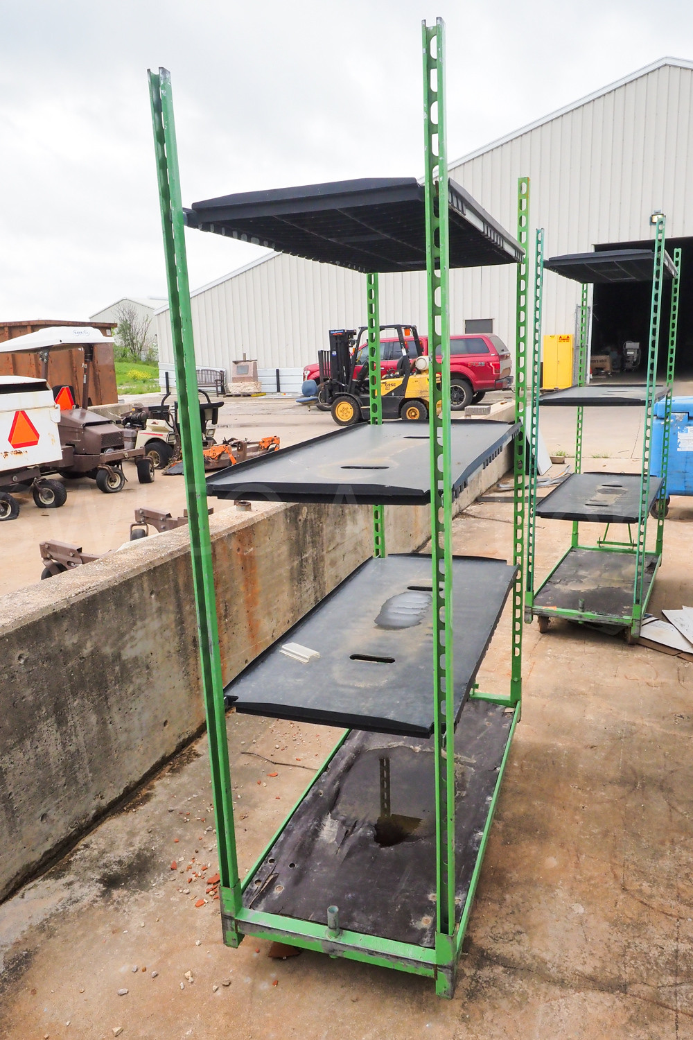 2 Green rolling racks Swico Auctions