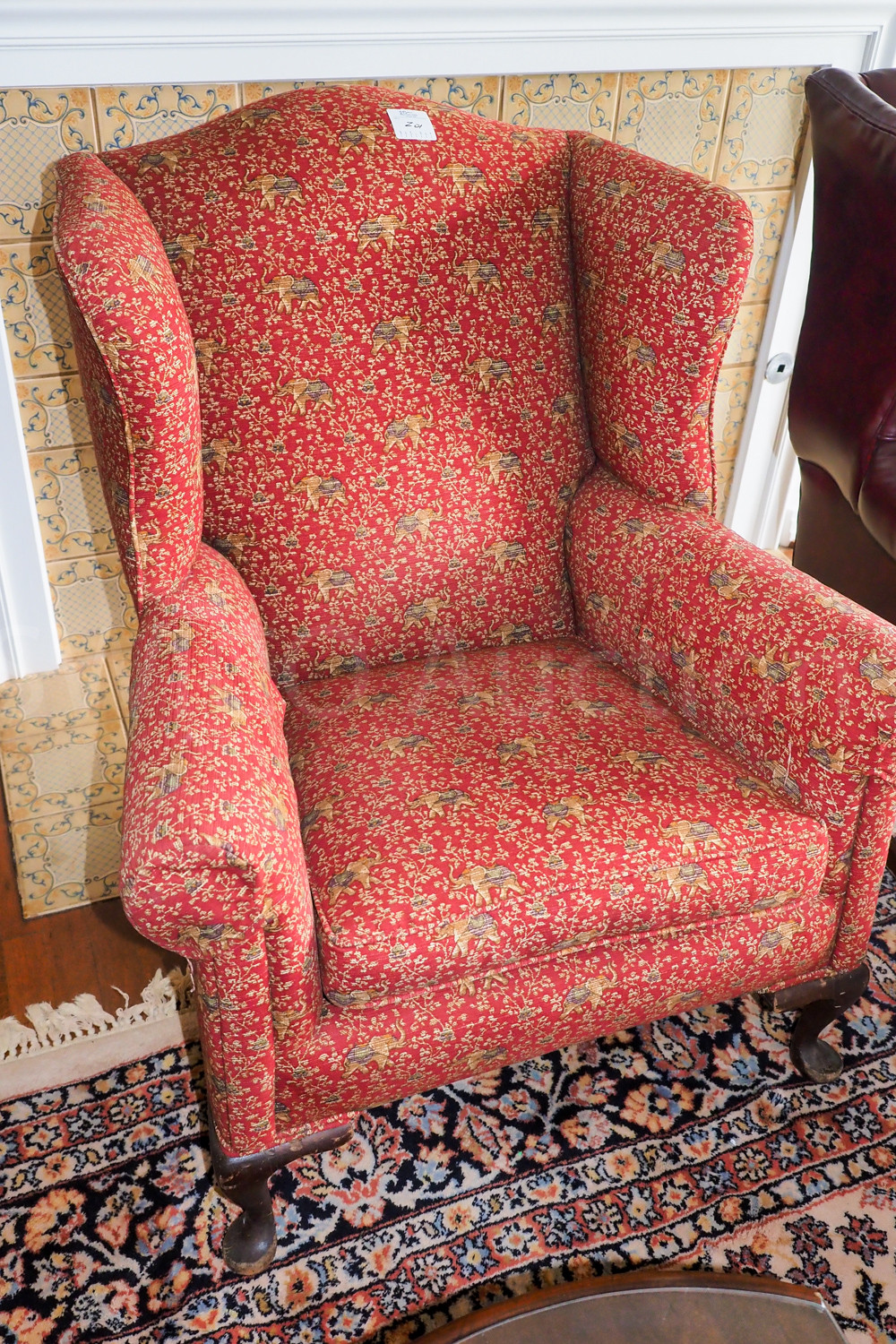 Red wing back chair Swico Auctions